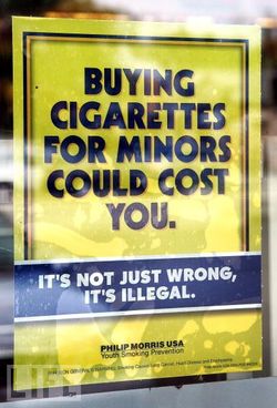 is buying cigarettes for minors illegal